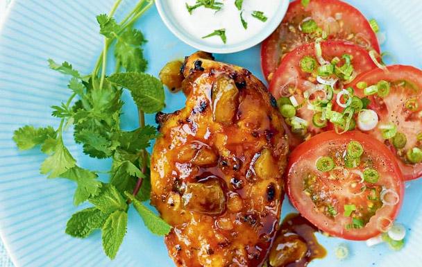 Spiced mango chicken with tomato and spring onion salad